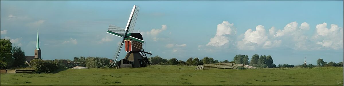 Molino de viento en una pradera en calma